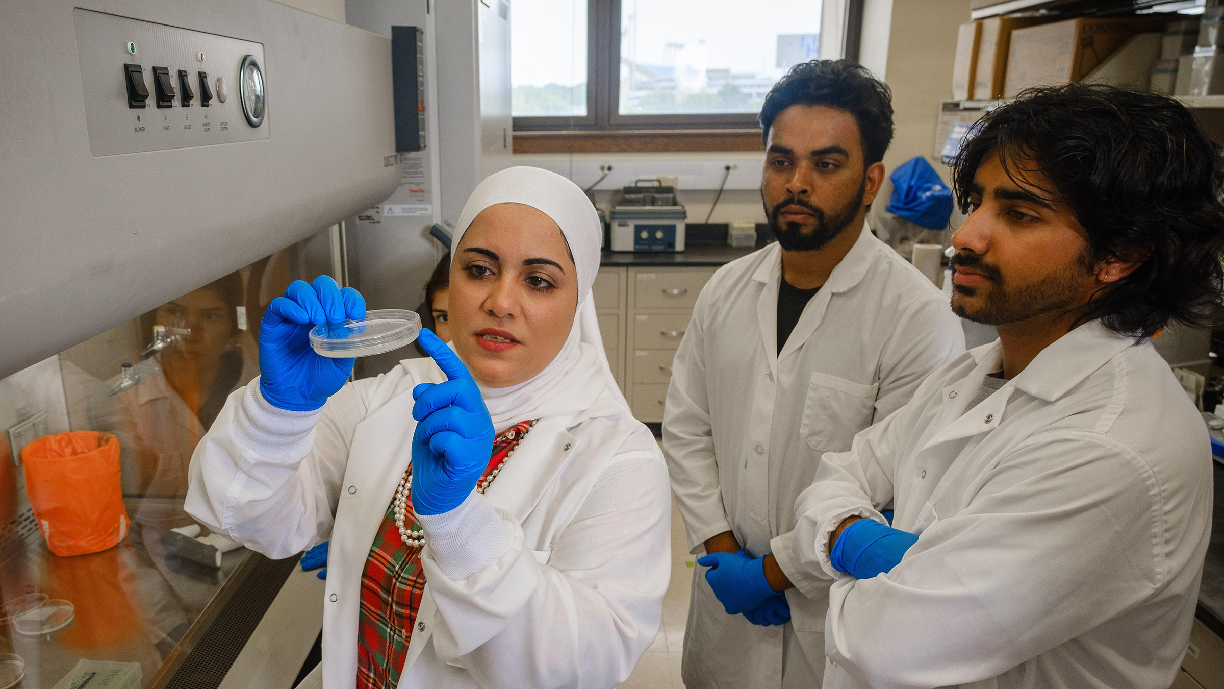 Yosra Helmy works in a lab to develop novel antibiotic alternative strategies to control resistant bacterial pathogens.